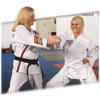 Mom punching in ATA Taekwondo class with Female Instructor